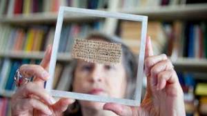 Harvard professor Karen King holds papyrus fragment