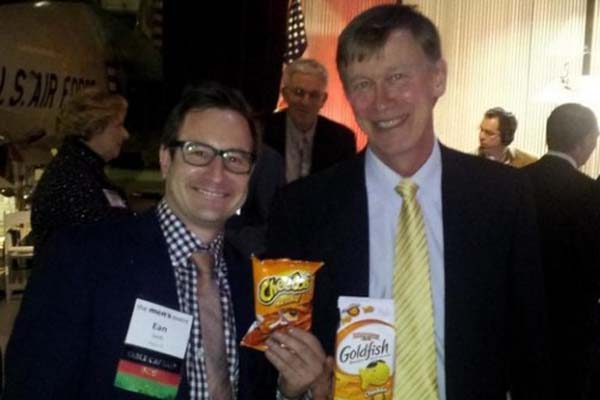 Gov. John Hickenlooper, right, poses with Ean Seeb, co-owner of Denver Relief, one of the state's largest dispensaries, holding Cheetos and Goldfish, the two things Hickenlooper told marijuana users not to "bust out" too quickly in the wake of Amendment 64's passage. (Photo: Denver Relief Consulting)