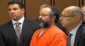 (Ariel Castro stands with his attorneys as the judge addresses him following his sentencing.)