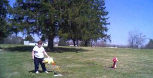 (Video captured a woman removing a stuffed animal from a baby's grave at Mansfield Memorial Cemetery on April 19, 2014/Courtesy: Ontario Police Department)