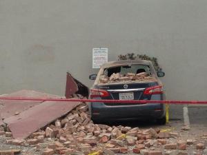 A car underneath earthquake debris in the Napa Valley