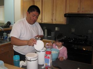 Kirimoto and his daughter Sara cook together in December 2010. His weight at the time was around 270 pounds, the heaviest he has ever been. It was during this month that he decided to make a lifestyle change and lose weight. Courtesy: Yusuke Kirimoto