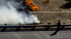 Roto-Rooter worker helps put out freeway fire