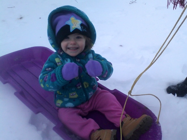 Nicole sledding
