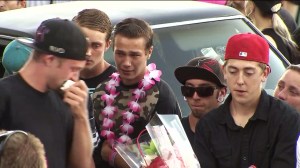 Friends gather at a vigil to remember two teens killed in a Cajon Pass crash. (Credit: KTLA) 