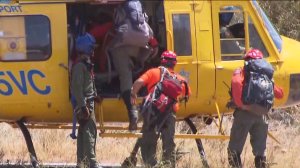 Searchers were ferried by helicopter to remote areas to search for Herdman on June 18, 2014. (Credit: KTLA)