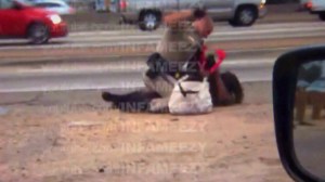 Video shot July 1, 2014, by a motorist showed a CHP officer throw a woman to the ground, straddle her body and repeatedly punch her. (Credit: David Diaz)