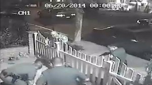 Surveillance video captured Santa Ana police officers beating a burglary suspect on June 20, 2014. 