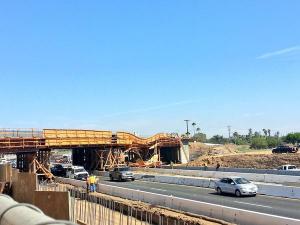 An overpass under construction collapsed, blocking the 215 Freeway in Perris on July 15, 2014. (Credit: @hippydriver)