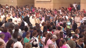 Thousands gathered at the Cathedral of Our Lady of the Angels to pray for child immigrants on Sunday, July 20, 2014. (Credit: KTLA)