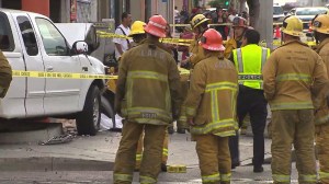 Firefighters responded to the scene of a deadly vehicle vs. pedestrian crash on July 28, 2014. (Credit: KTLA)