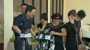 The family of Xinran Ji weeps outside a funeral home in Alhambra on July 31, 2014. (Credit: KTLA)