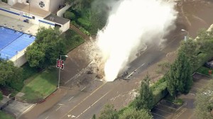 The water main break sent a geyser gushing into the air on July 29, 2014. (Credit: KTLA)