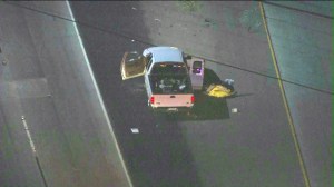Authorities investigate a double shooting on the 91 Freeway on Monday, July 14, 2014. (Credit: KTLA)