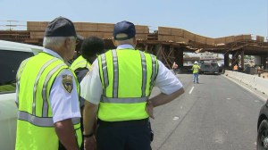 Workers were at at 215 Freeway overpass in Perris after a tractor-trailer collided with a support beam, causing the bridge to collapse. (Credit: KTLA)