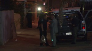 Investigators were combing for clues in an alley in Hawthorne after a man was shot and killed on July 16, 2014. (Credit: KTLA)