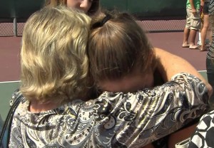 Morgan Wilson's supporters hugged at the prayer vigil for her on July 10, 2014. (Credit: KTLA)