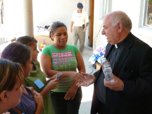 Bishop Gerald Barnes greeting immigrants in at on July 10, 2014, at t. Joseph's Catholic Church in Fontana in a photo provided by the church. 