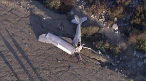 A single-engine plane crashed near a Rancho Cucamonga neighborhood on Friday, July 18, 2014. (Credit: KTLA)