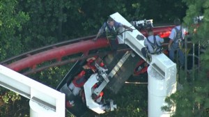 Rescuers worked to help passengers off the Ninja roller coaster at Magic Mountain July 7, 2014. (Credit: KTLA)