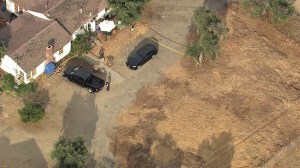 Authorities were responding to the scene where a young boy was trapped in a hot vehicle in Sylmar on July 30, 2014. He later died. (Credit: KTLA)
