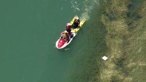 Divers searched the water after a boat overturned at Pyramid Lake on Sunday, June 29, 2014. (Credit: KTLA)