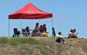 Family members watched the search effort for missing teen swimmer Joseph Sanchez on July 10, 2014, in Rancho Palos Verdes. (Credit: KTLA)