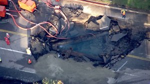 After a water-main break on Sunset Boulevard, crews worked to make repairs on Wednesday, July 30, 2014. (Credit: KTLA)