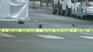 A police vehicle responding to a scene in West Adams struck and killed a naked man who was wearing only tennis shoes and lying on a street on July 27, 2014. (Credit: KTLA)