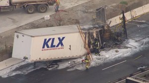 A big rig caught fire on the 5 Freeway in Santa Fe Springs, prompting the closure of all southbound lanes ahead of the morning commute on Aug. 1, 2014. (Credit: KTLA)