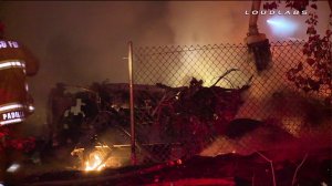 Firefighters were able to put out the flames that erupted when a big rig veered off the 710 Freeway and crashed into a tree on Aug. 1, 2014. (Credit: Loudlabs)