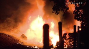 A big rig burst into flames after it veered off the 710 Freeway and crashed into some brush. (Credit: Loudlabs)