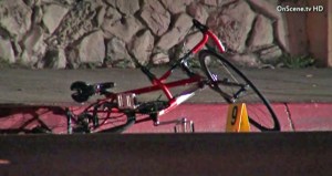 Dotson's bike remained at the scene where investigators worked after he was struck in Gardena on June 26, 2013. (Credit: OnScene TV)