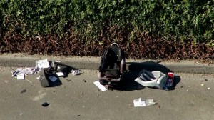 An SUV flipped over on the 60 Freeway in Chino, injuring at least three children. (Credit: KTLA)