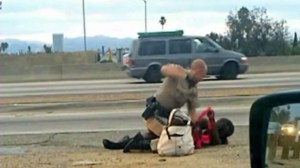 Video shot by a motorist showed a CHP officer throwing a woman to the ground, straddling her body and repeatedly punching her on July 1, 2014. He was later identified as Daniel Andrew; she was identified at Marlene Pinnock. (Credit: David Diaz)