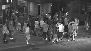 Fullerton police provided this still image of surveillance footage that captured an assault in the 100 block of North Harbor Boulevard on Aug. 23, 2014. Police asked for the public's help in identifying two men who injured three others. 