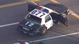 A pursuit ended at the intersection of 37th and Hill streets in South Los Angeles before one of two gunman was shot and killed by police on Monday, Aug. 18, 2014, authorities said. (Credit: KTLA)