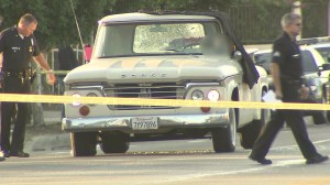 A man's body was found in a vehicle with shattered windows in Pacoima on Aug. 21, 2014. (Credit: KTLA)