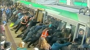 Passengers rescued a trapped commuter by pushing a train car in Perth, Australia, on Wednesday, Aug. 6, 2014. (Credit: CNN)