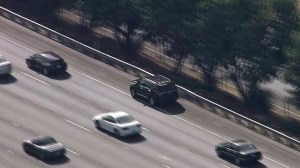 Authorities were in pursuit of a black SUV in the San Fernando Valley on Monday, Aug. 25, 2014. (Credit: KTLA)