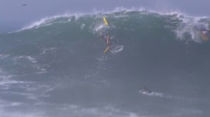 Three lifeguards attempting to rescue a tired swimmer were caught in violent waves that reached up to 25 feet on Aug. 27, 2014. (Credit: KTLA)