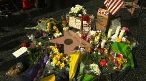 A memorial grew at Robin Williams' star along the Hollywood Walk of Fame Tuesday, August 12, 2014, a day after the star took his own life. (Credit: CNN)