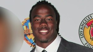 USC football player Josh Shaw attends a Los Angeles Fire Department Foundation event in Sherman Oaks April 5, 2014. The woman next to him has been blurred. (Credit: David Buchan/Getty Images)