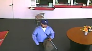 Police asked the public for help in identifying a man suspected of robbing a check cashing store in Wilmington. (Credit: Los Angeles Police Department) 