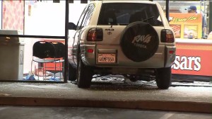 Ten people were injured when an SUV crashed into Little Caesars restaurant in Pacoima on Aug. 18, 2014. (Credit: Kimberly Cheng/KTLA)