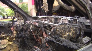 Four Santa Ana residents were displaced after a fire broke out in a vehicle and spread to others and a garage before being extinguished on Aug. 31, 2014. (Credit: KTLA)