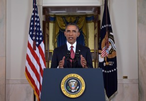 U.S. President Barack Obama delivers a prime time address from the Cross Hall of the White House on September 10, 2014, in Washington, DC. Vowing to target the Islamic State with air strikes "wherever they exist," Obama pledged to lead a broad coalition to fight IS and work with "partner forces" on the ground in Syria and Iraq. (Credit: Saul Loeb-Pool/Getty Images)