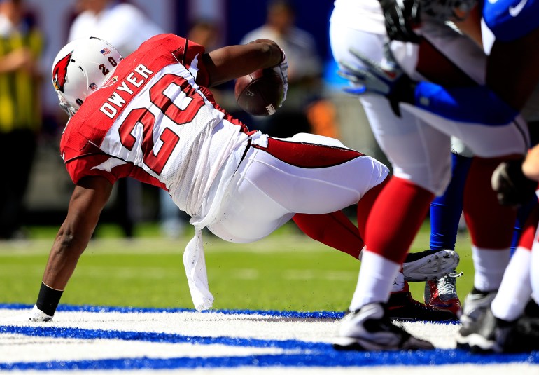 Running back Jonathan Dwyer, #20, of the Arizona Cardinals is shown scoring a touchdown against the New York Giants on Sept. 14, 2014, in East Rutherford, New Jersey. (Credit: Alex Trautwig/Getty Images)