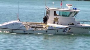 A vessel described as a professional rowboat was towed back to Newport Beach on Wednesday, Sept. 17, 2014. (Credit: KTLA)