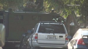 A SWAT team responded and a standoff ensued after a gunman shot at an ice cream truck in San Bernardino on Saturday, Sept. 14, 2014, authorities said. (Credit: Newspro News)